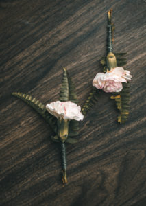 2 wedding boutonnieres made of carnation and fern